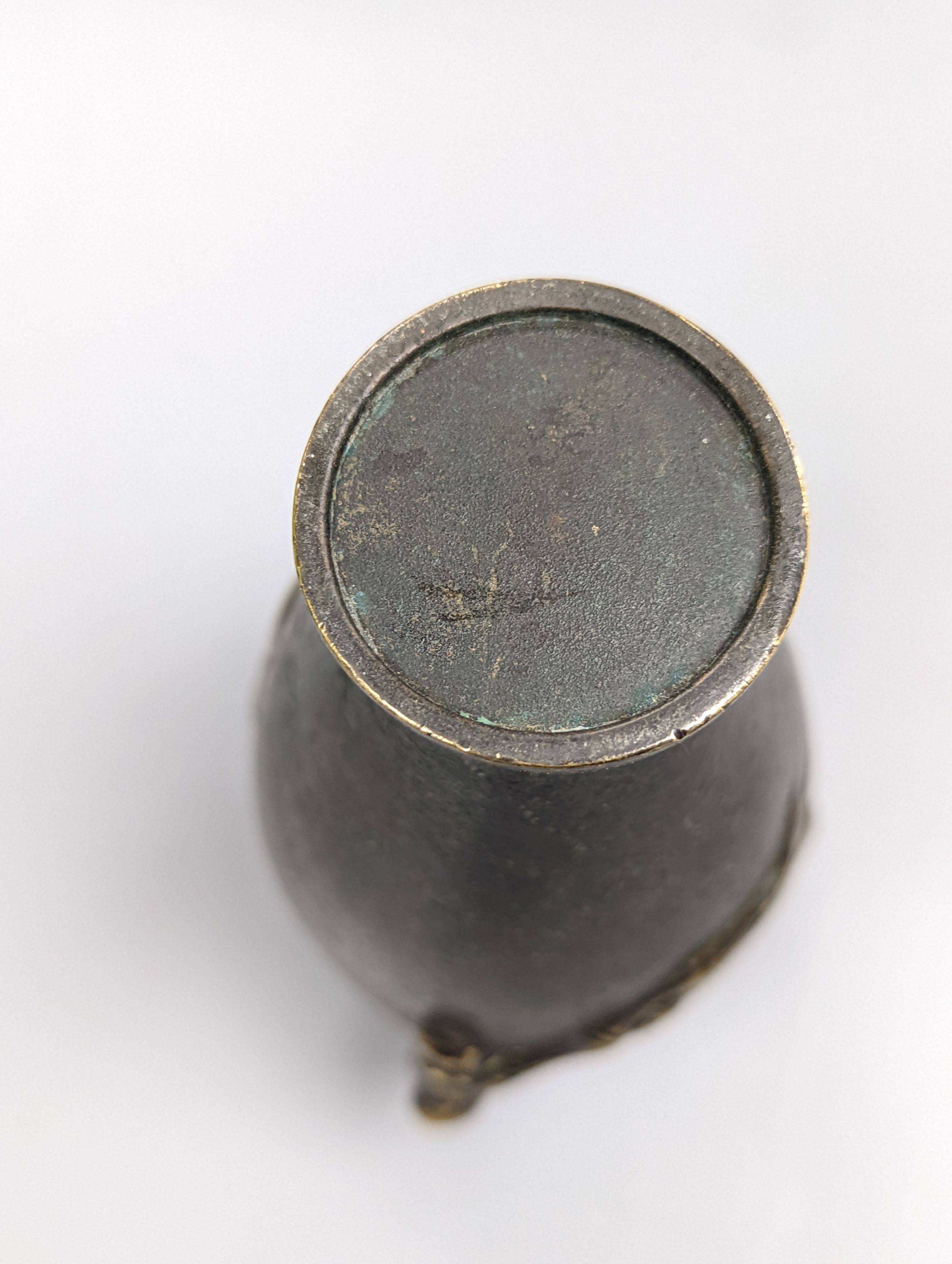 A Chinese bronze vase, 12cm., and an Islamic pierced brass lamp